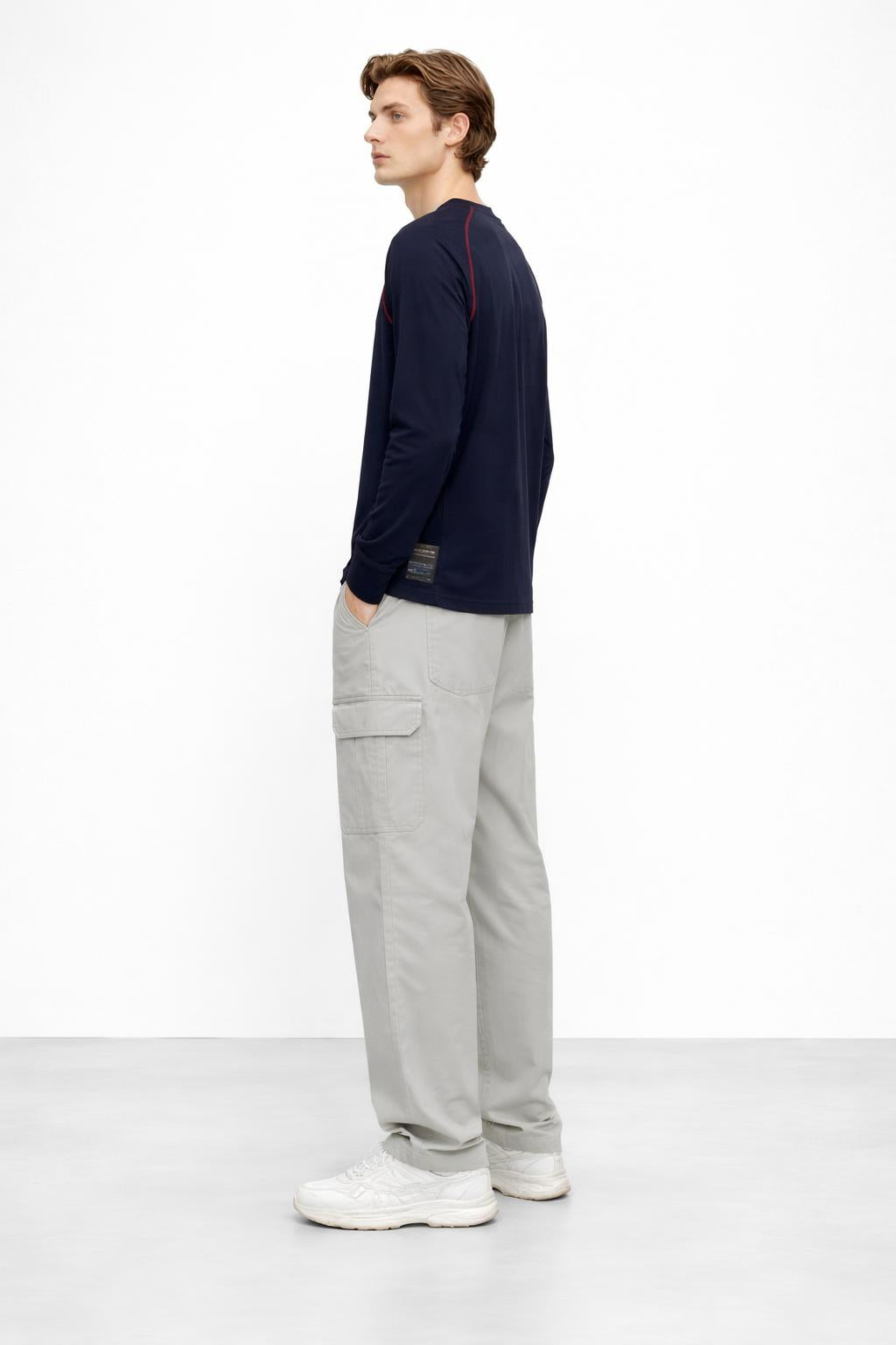 Side profile of the model wearing Long Sleeves Knit