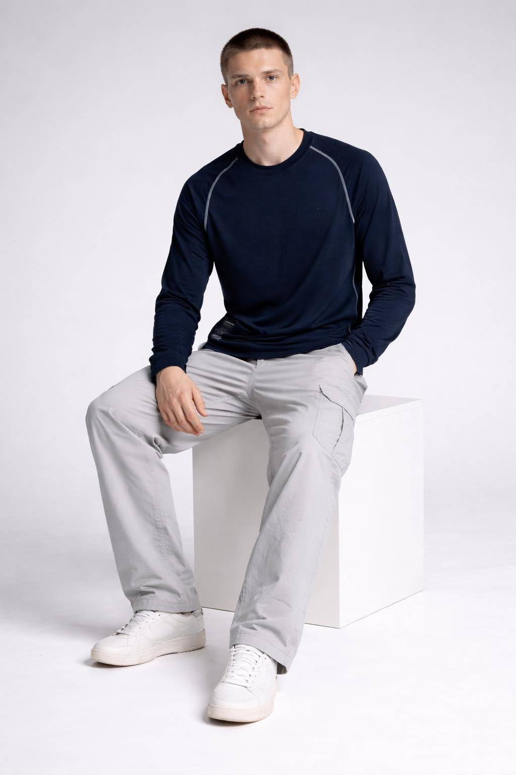 Model sitting while wearing Long Sleeves Knit